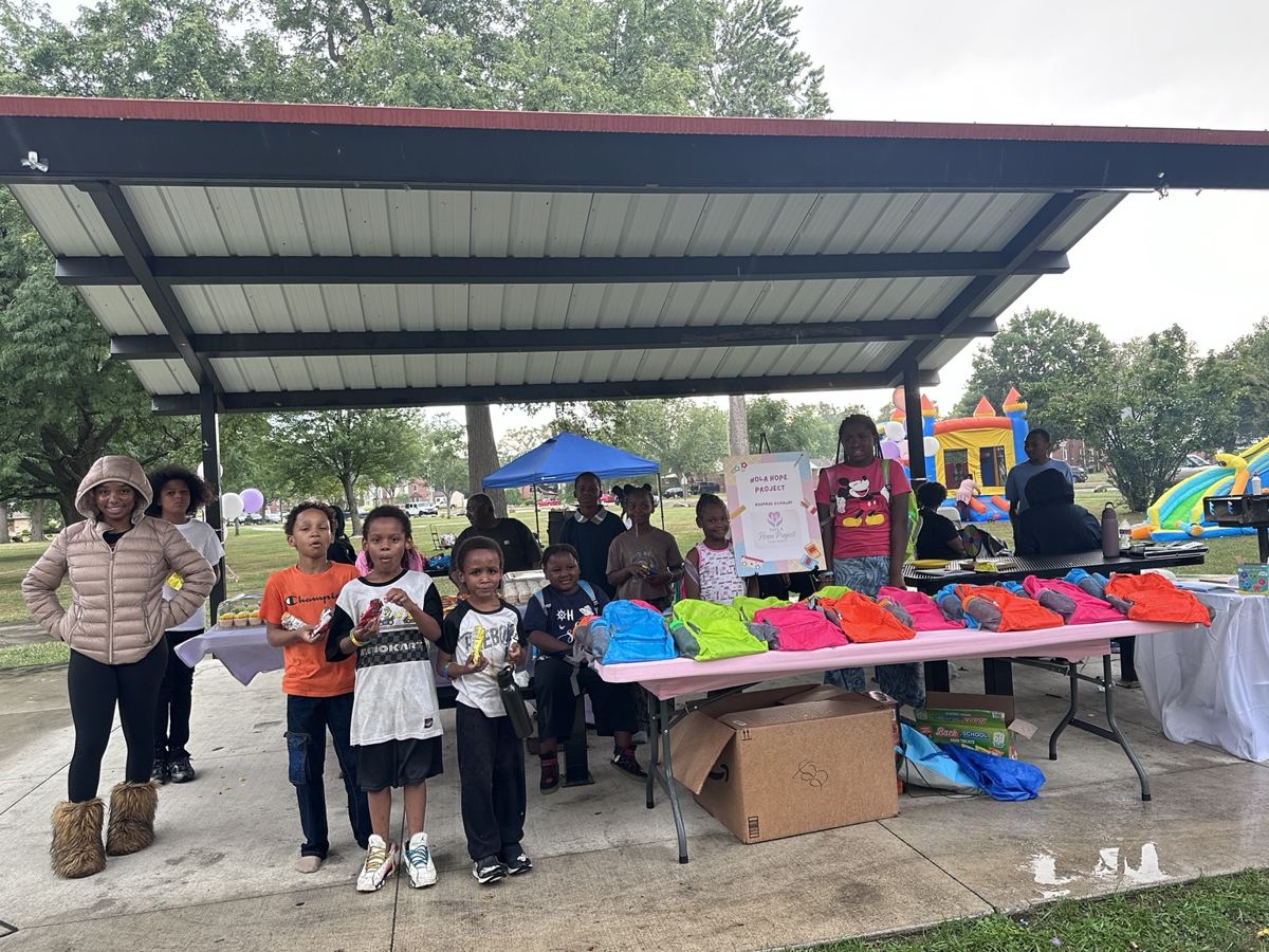 Children gathered at the Nola Hope Project bookbag giveaway