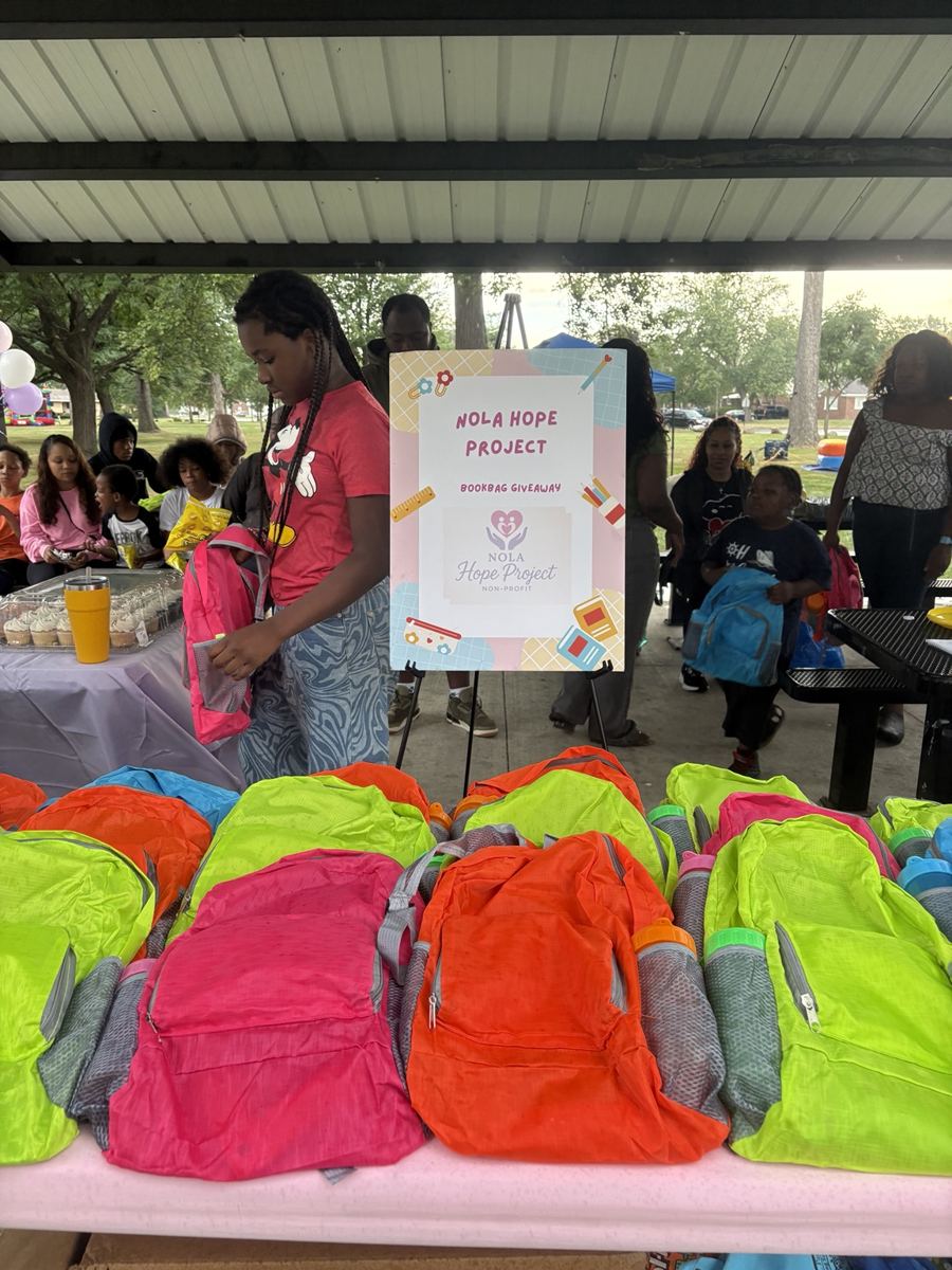 Colorful backpacks ready for distribution at the community event